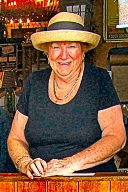 Joan Blomberg, as many remember her – leaning over the French Door of “American at Heart” to chat with passers-by on S.E. 13th Avenue in Sellwood.