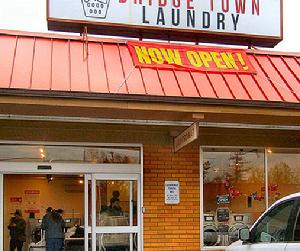 The owners of the new �Bridge Town Laundry� on Johnson Creek Boulevard are Christopher and Febrina Ahles.