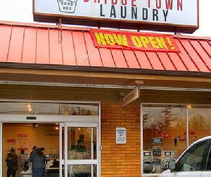 The owners of the new “Bridge Town Laundry” on Johnson Creek Boulevard are Christopher and Febrina Ahles.