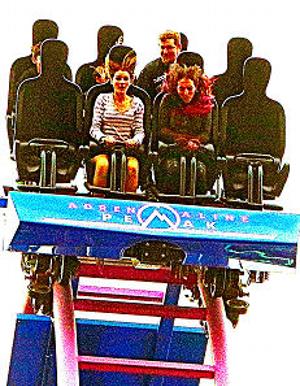 Even those brave enough to ride the Adrenaline Peak looping roller coaster look a bit worried about their decision, on the edge of the rides first big drop.