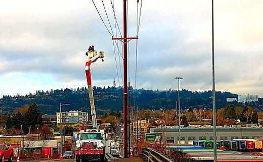One of the most disruptive events in the December 27 wind and rain storm was the toppling of four tall wooden power poles across the Holgate Viaduct over the Brooklyn Train Yard, bringing down not only distribution powerlines but regional high voltage transmission lines, leading to power outages of over 24 hours in checkerboarded sections of Southeast Portland.