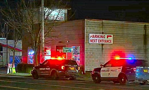 East Precinct officers and an ambulance were called to this Foster-Powell neighborhood bar and grill, after a shooting in the parking lot seriously wounded a customer entering with his fiancée.