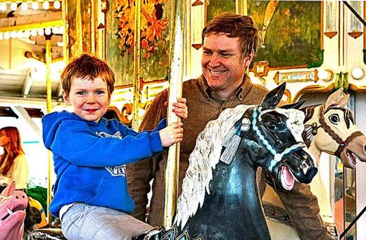 At Oaks Amusement Parks 2025 opening day, guests River and Reed Harkness enjoyed a ride on the Herschell-Spillman Noahs Ark Carousel.