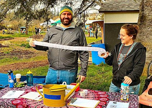 At the Earth Day Fair welcome table at the Learning Gardens Laboratory, we encountered PSU Grad student Kris Jensen, and PSU Learning Garden Lab Senior Capstone student Dolly Niederlander.