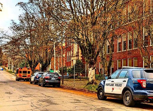 Police cruisers were parked alongside Cleveland High School after the December 12th shooting that left a student injured. The shooting renewed calls to reinstate School Resource Officers in Portland Schools.