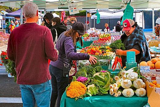 The stand of Pablo Munoz Farms in Dayton, southwest of Portland, was very busy during the last day of the Moreland Farmers Market this season.