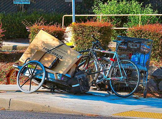 After the rider was rushed away by ambulance from the collision on S.E. Powell Boulevard, his bike and belongings were moved over to the north sidewalk for later safekeeping.