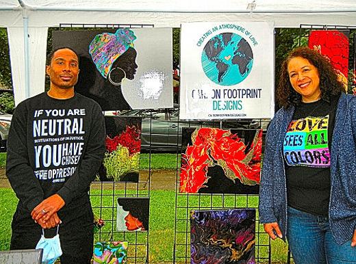Dustin and Heather Daniel were in Woodstock selling artwork created by Heather; their company name, �Carbon Footprint Designs�, was suggested by Dustin. 
