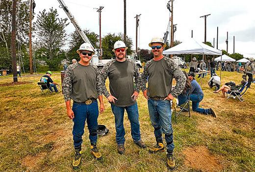 Moments before climbing poles for their next event, Brooklyn�s PGE 17th Avenue Portland Service Center team members stopped for a photo: From left, they�re Cody Bell, Hank Williams, and foreman Colten Hevern.