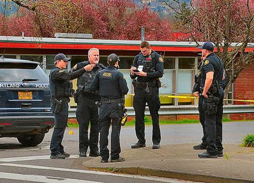East Precinct and FIT officers find evidence of the shooting where a neighbor said it began � as a traveling gunfight, alarmingly close to an elementary school, seen in the background.