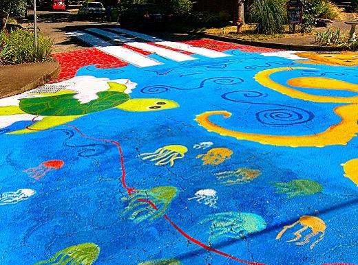 The northeast corner of the latest street repainting of Share-It Square in Sellwood features the �Turtle that supports the Earth�, with a whole lot of jellyfish.