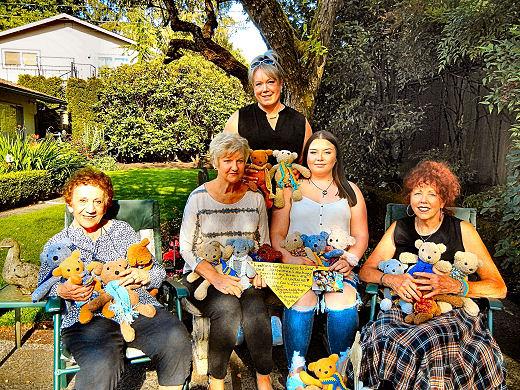 Creators of teddy bears for an independent project for Ukrainian children are, from left: Alice Hiser, Jeanette Stout, Bri, and Nanci Shaughnessy. Standing is Chyanna.